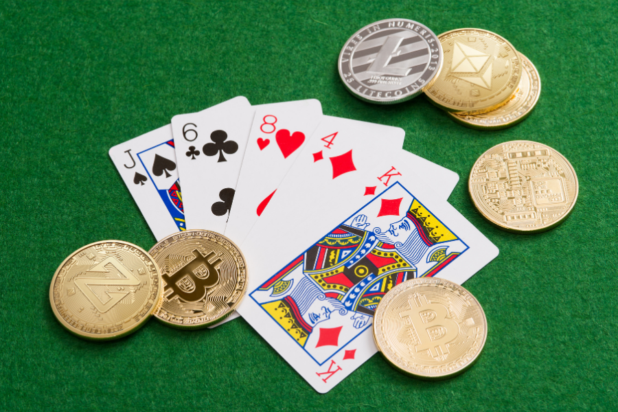 crypto currencies and a deck of cards on a table 